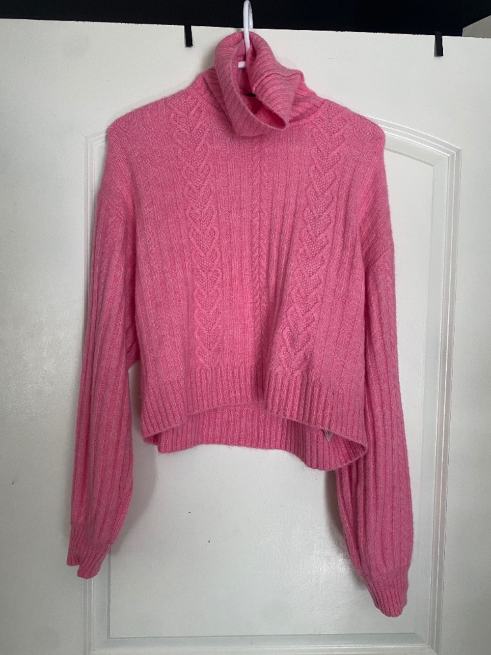 Divided pink oversized cropped turtleneck sweater